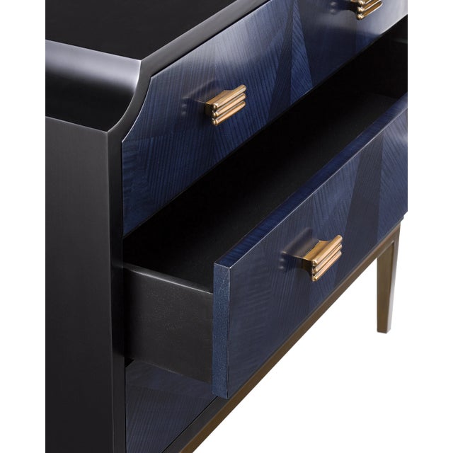 The Kallista Blue Chest has a dark sapphire blue finish that enlivens the sycamore veneers on its door fronts. The wood...