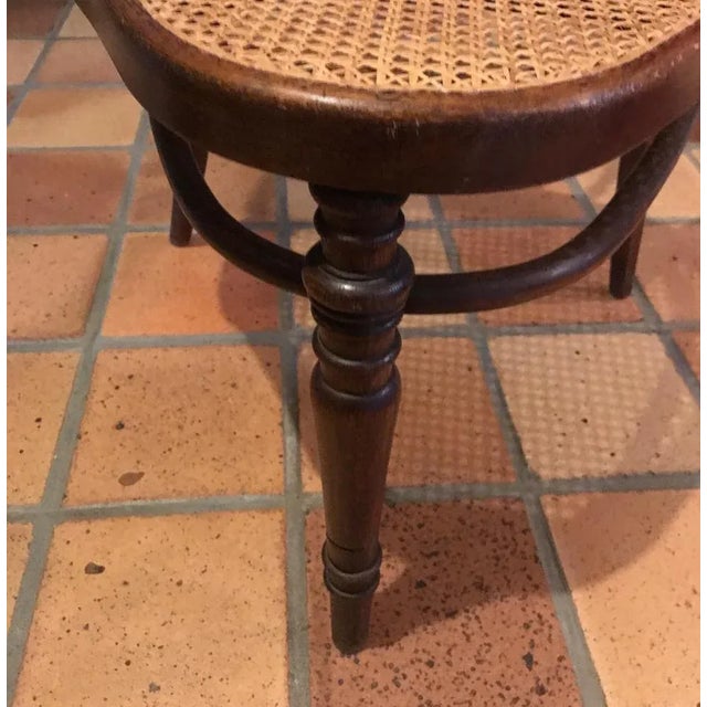 Tripod chair produced by Kohn, circa 1900. Perfect condition new caning. Stamped and labeled. This piece is attributed to...