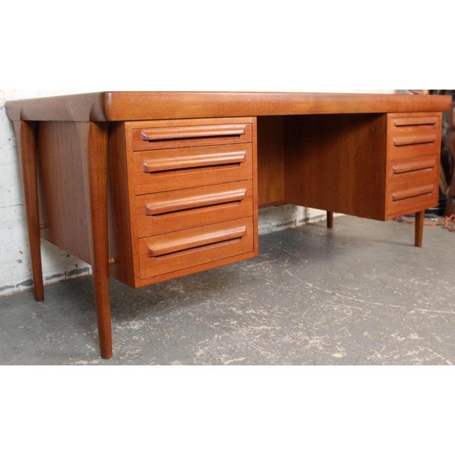Mid-Century double-sided freestanding "No. 12" teak desk by K.B. Simonsen for Faarup Møbelfabrik. Expertly crafted in...