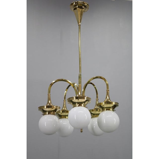 A beautifully restored 1930s art deco / late secession chandelier produced in czechoslovakia. Constructed from polished...
