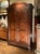 This authentic 18th-century Italian walnut armoire represents the pinnacle of Piedmontese Baroque cabinetmaking, defined...