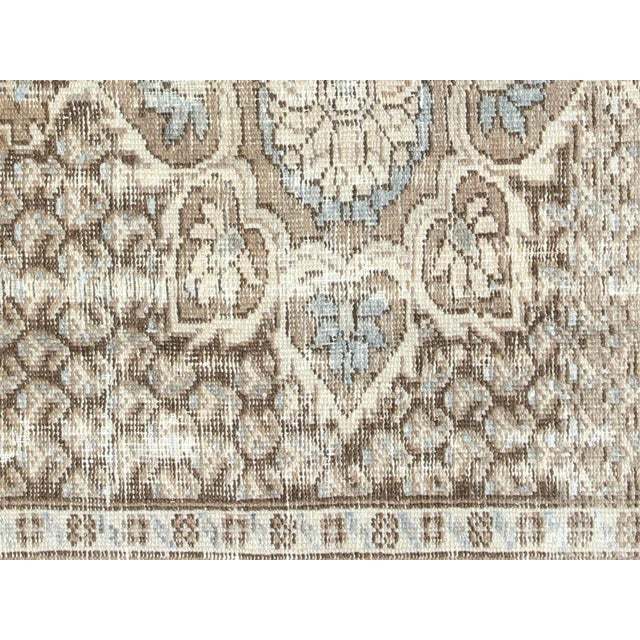 This authentic Semi Antique Persian Mahal Rug is a beautiful piece of craftsmanship, featuring a wool-on-cotton...