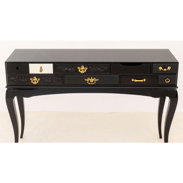 Boca do Lobo "York" Black Lacquered Console Table, the separate gray glass top with drawers with gilt brass handles above...