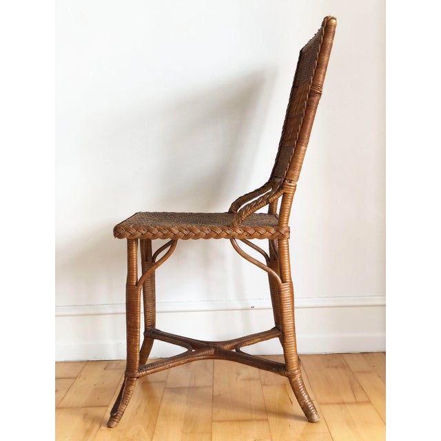 A rare vintage rattan chair by renowned Danish maker Robert Wengler, often regarded as the father of modern Danish wicker...