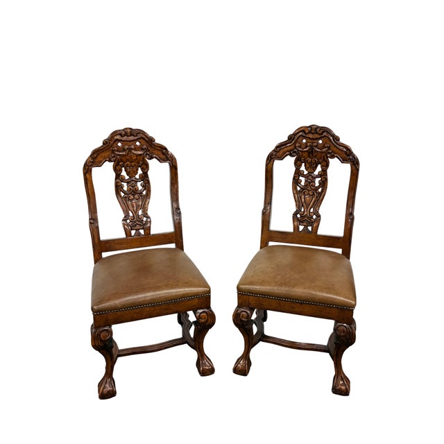 Handsome set of four Dutch Chippendale-style dining side chairs featuring richly carved fruitwood-tone frames, tobacco-...