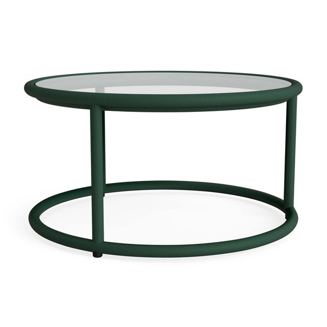 A free flowing frame design and transitional glass tabletop define the Walter Lamb Aluminum 20" Round Occasional Table....