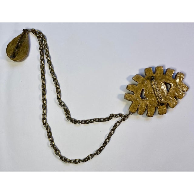 A one-of-a-kind pin by Todd Oldham handmade in the early 1980s, an eye with lashes and a tear drop connected with a double...
