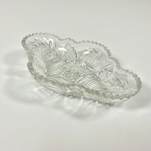 Between 1876 to 1916 American glass producers hand cut glass with sawtooth edging that became known as American Brilliant...