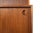 Origin: Denmark Designer: Unknown Manufacturer: Unknown Era: 1960s Materials: Teak, Smoked Glass Measurements: 31.5" wide...