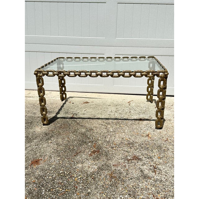 Make a bold, sculptural statement with this rare vintage Brutalist-style chain-link coffee table, originating from the...