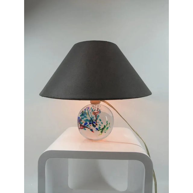 Small table lamp made of synthetic glass. Very decorative design in flower shape. The specified dimensions are including...