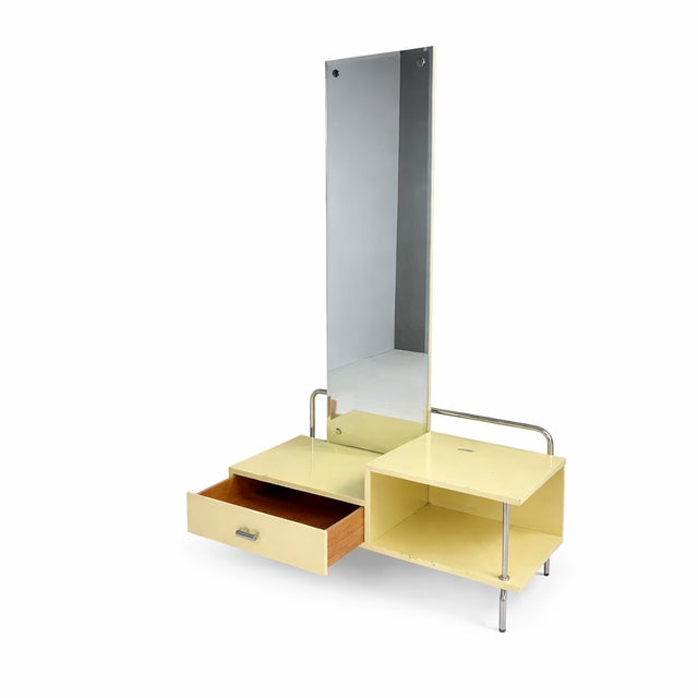 A refined bauhaus dressing table from the 1930s, produced by slezák in czechoslovakia. The piece reflects functionalist...