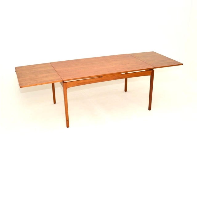 A superb vintage Danish teak extending dining table, dating from the 1960’s. This is of the utmost quality, with an...