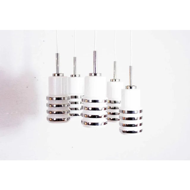 70s cascade suspension chandelier This is a chandelier that will have a place of choice in your interior. with its 5...