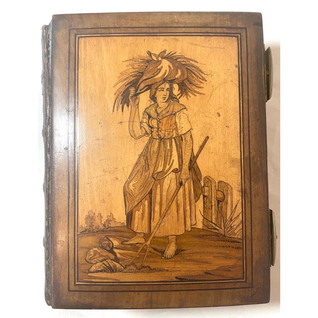 Up for sale is a very rare antique 19th century handmade wooden marquetry photo album. The back and front cover are carved...