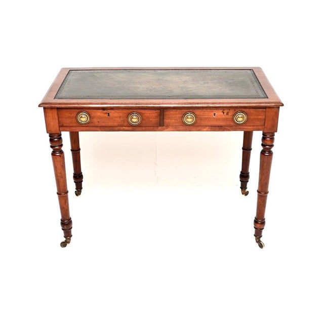 A wonderful antique Georgian mahogany leather top writing table / desk. It was made in England, it dates from around the...