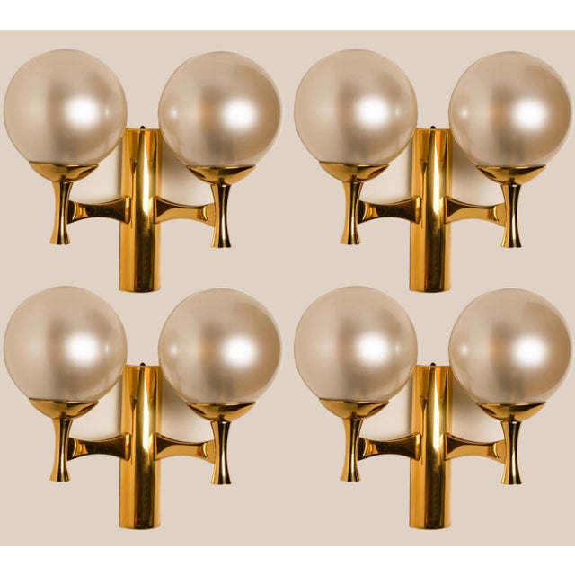 1 of the 4 brass and opaline glass wall lights, europe, 1960s. The wall light consists 2 opaline glass spheres. Due the...