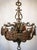 Two matching guada influenced bronze and brass candelabras in original condition. approx date: early 20th century each...