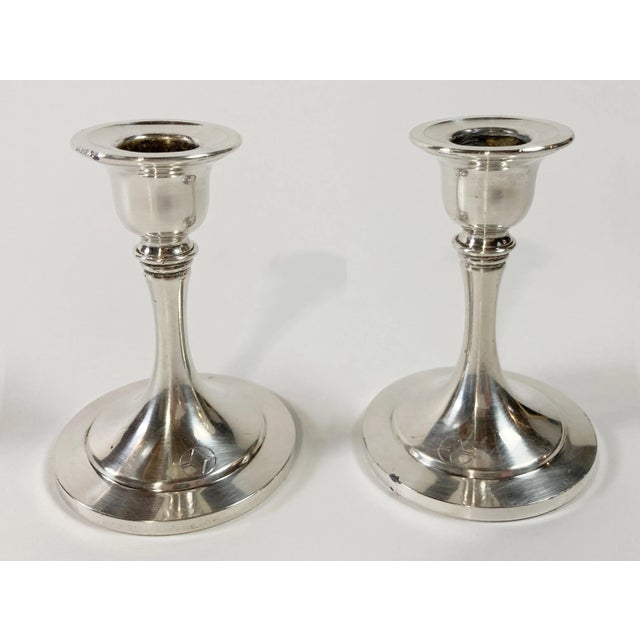 Classic pair of heavy silverplate candlesticks. Marked Oneida USA. Patina.