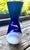 A beautifully proportioned Japanese porcelain vase featuring a graceful hourglass silhouette decorated with a single...