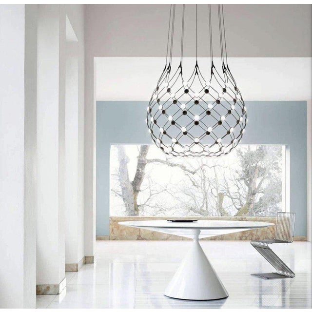 The pendant Mesh from Luceplan is designed by Francisco Gomez Pax and has a next to transparent structure and dramatic...
