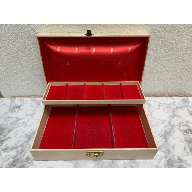 Mid century 1960s red velvet lined jewelry box with several cubbies and compartments for storage. Red velvet lined...