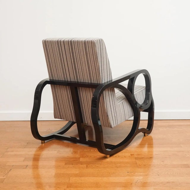 Compound curves and luxurious finishes make this Juniper lounge chair one-of-a-kind. Drawing inspiration from Coco Chanel...