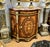 Elevate your interior with this stunning French-style marquetry cabinet, masterfully crafted with intricate floral inlay...