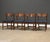 A set of four mid century modern walnut Dania dining chairs with new blue tweed fabric and restored walnut frames by...