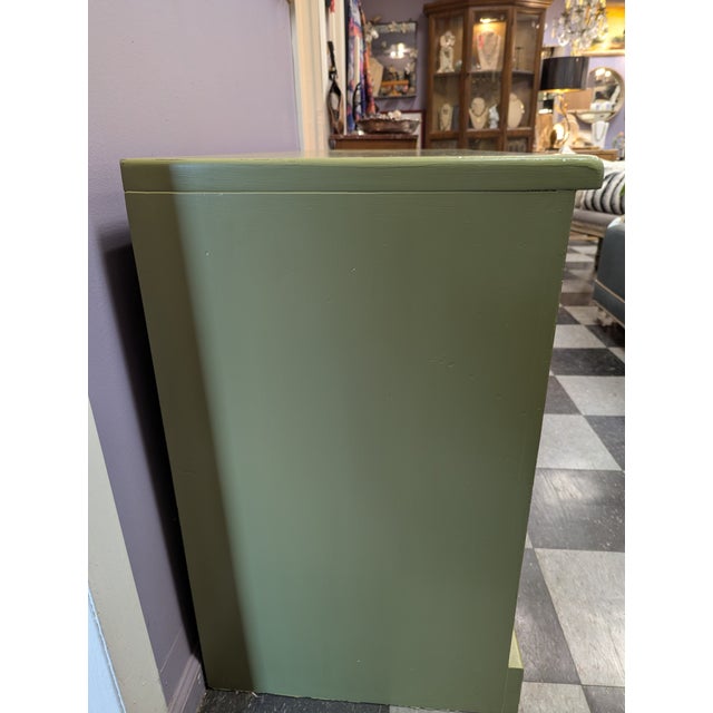 Vintage 9 drawer solid wood dresser. Newly painted in a mid-century green with new brushed gold cup pull hardware. Dove...