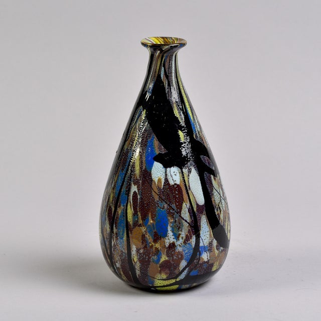 Found in Italy, this vase by Carlo Moretti dates from the 1990s. This mouth blown piece is 11.5” tall and is decorated...
