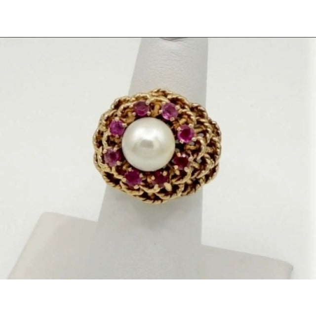 Vintage 18K Gold Domed Basket-Weave Pearl and Ruby Cocktail Ring. The ring design centers on a luminous white cultured...