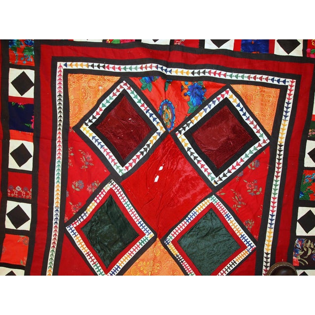 Handmade vintage Uzbek patchwork Suzani rug in original condition. This Suzani is in colourful shades. On the cotton red...