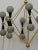 Particular circular sputnik, with brass structure and Murano grey glass spheres. It looks like a system of planets that...