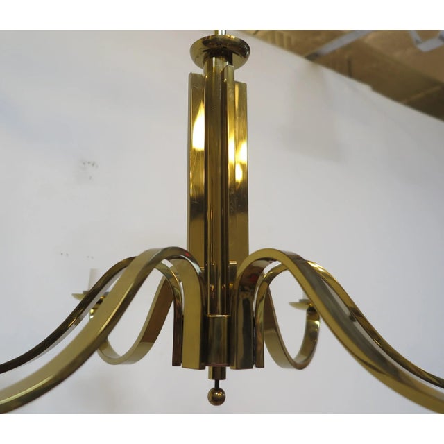 Mid Century Brass Tower Chandelier. Stunning Brass Tower Chandelier with wide brass flat bar arm design having a brass...
