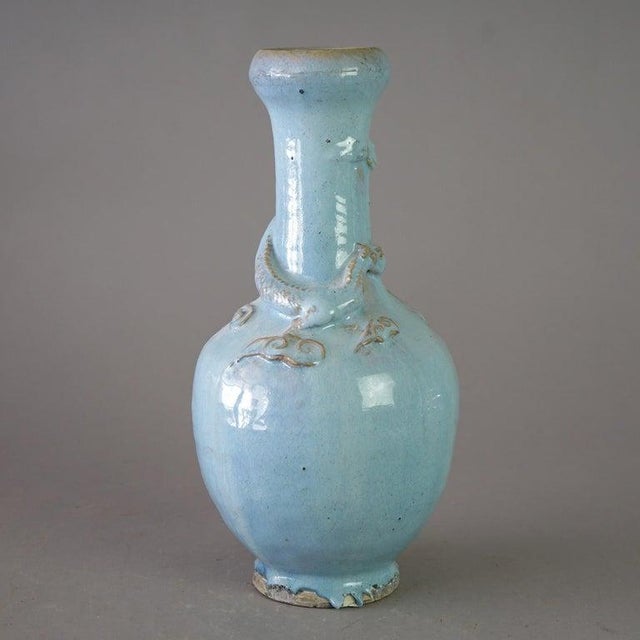 An antique figural Chinese vase offers art pottery construction with applied dragon, c1920 Measures - 15"h x 7"diam An...
