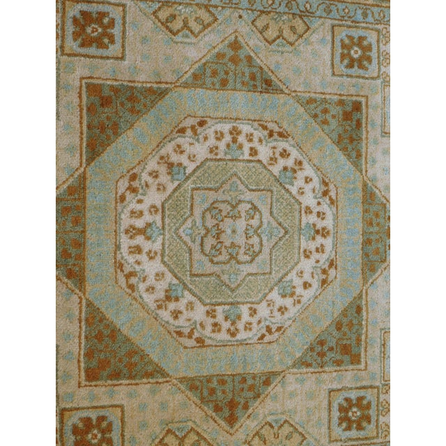 Hand-knotted vintage style runner rug with geometric and octagonal medallions in neutral and muted tones of beige, cream...