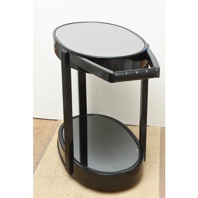 This stunning and very versatile vintage Art Deco bar cart or trolley is very moderne. It is so sturdy and wheels...