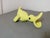 A beautiful object with a very fun and playful use. A parro-shaped baby food eater that fits on the edge of the plate. One...