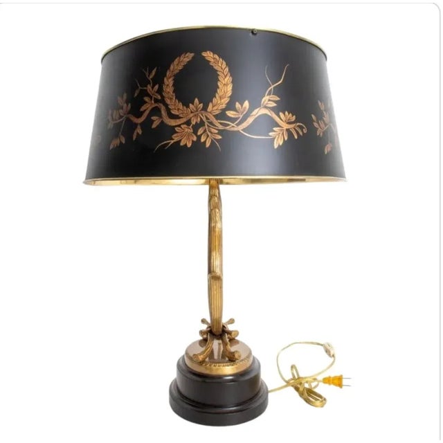 Elegant Frederick Cooper table lamp. Brass Laurel wreath mounted on wooden base. Laurel motif on black metal shade with...
