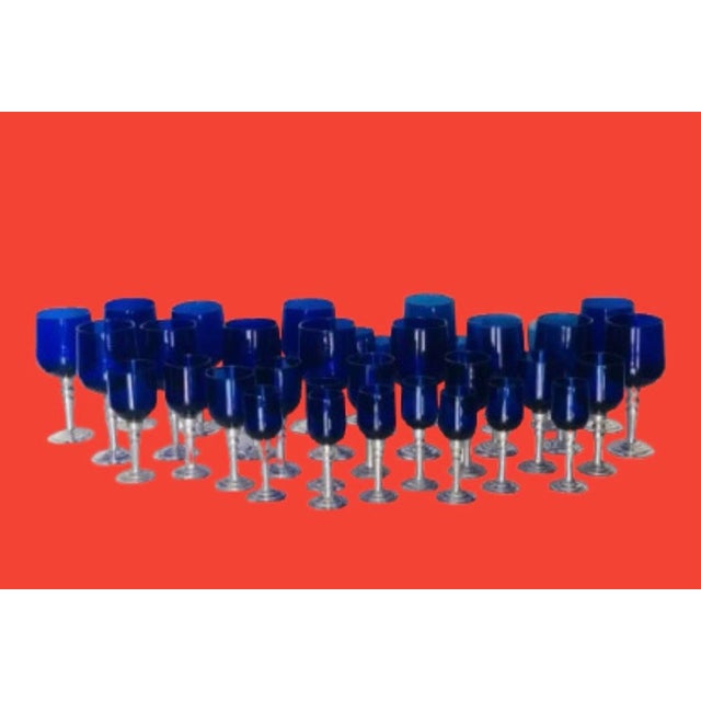 Stunning vintage collection of one of a kind cobalt blue-blown glasses a very rare large collection with pewter stems, it...