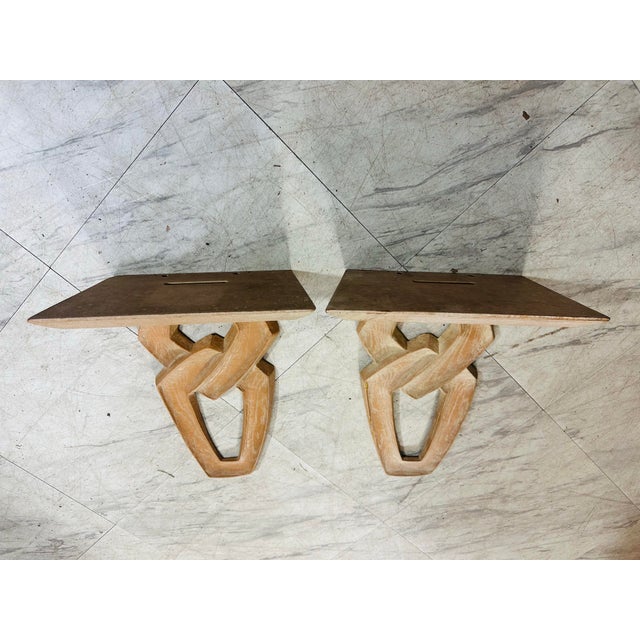 This is a pair of sculptural wooden wall brackets or corbels. Here’s a detailed description: Material & Finish • Made of...
