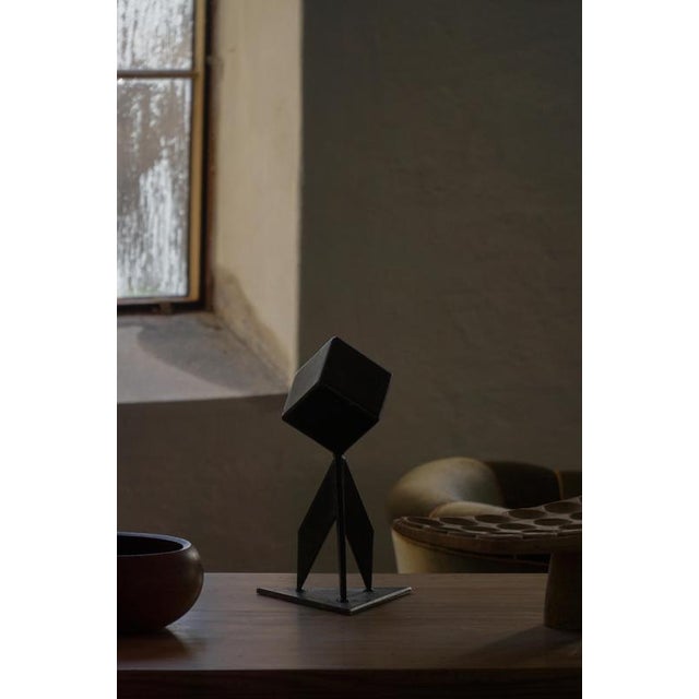 A beautiful abstract Scandinavian metal sculpture from the mid-20th century, executed in painted iron with a dynamic,...