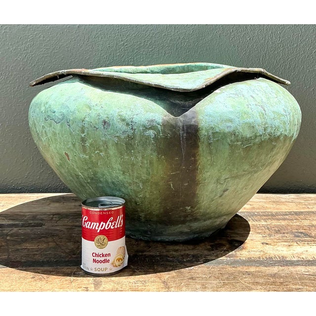 This monumental vintage planter is a masterclass in Brutalist texture and organic form. Crafted from heavy bronze, the...