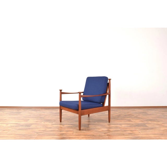 This armchair was made in Denmark in the 60's. The frame of the armchair is made of solid beech wood and has been...
