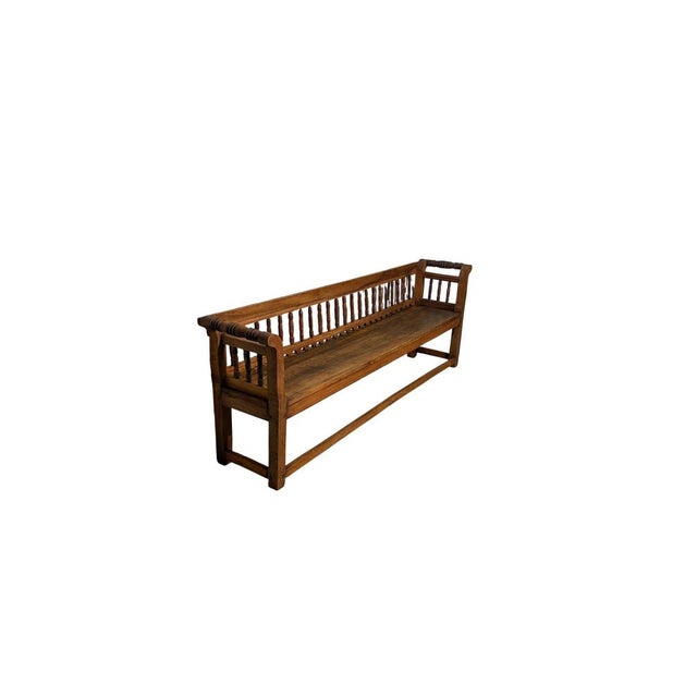 An elegant 19th-century period bench crafted from fine solid walnut and featuring the refined craftsmanship typical of the...