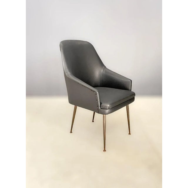 Brass and iron structure, padded fabric covering This piece is attributed to the mentioned designer/maker. It has no...