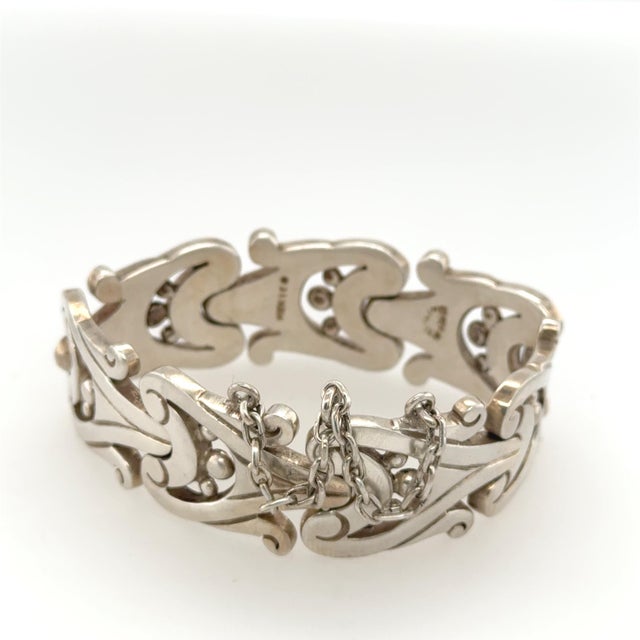Sterling Silver Bracelet stamped Mexico and 925 sterling silver on the inside. Dated to the 20th Century. Comprised of...