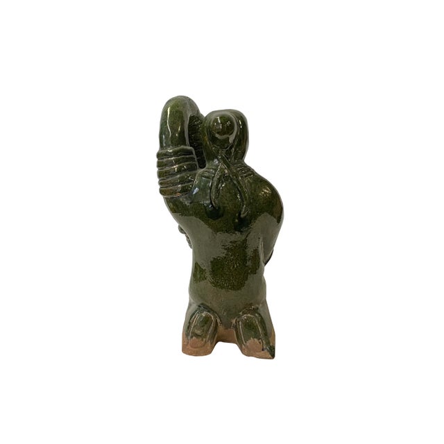 The Vintage Oriental Ceramic Green Man Oil / Candle Lamp-Shaped Display Figure is a captivating and exquisitely crafted...