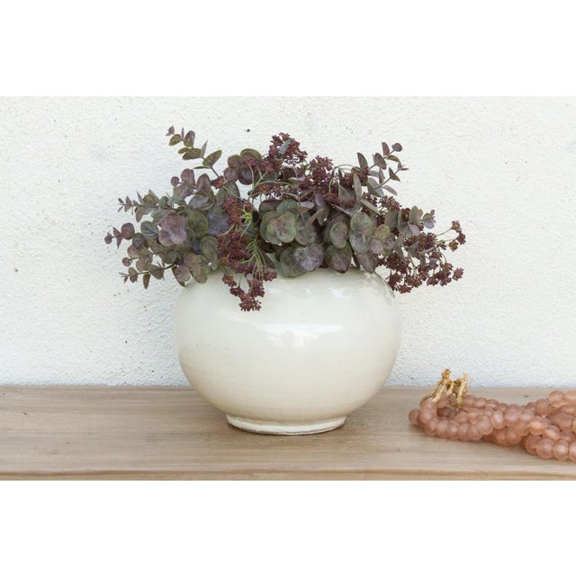 Discover the enduring allure of simplicity and form with this elegant white porcelain pot. Measuring a generous 13 inches...